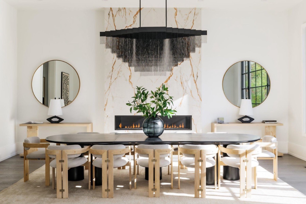 Formal dining room with marble feature wall and linear chandelier